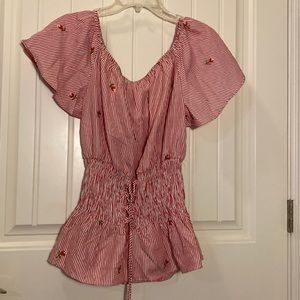 Roommates size large. Flutter sleeve peasant top with corset style waist.